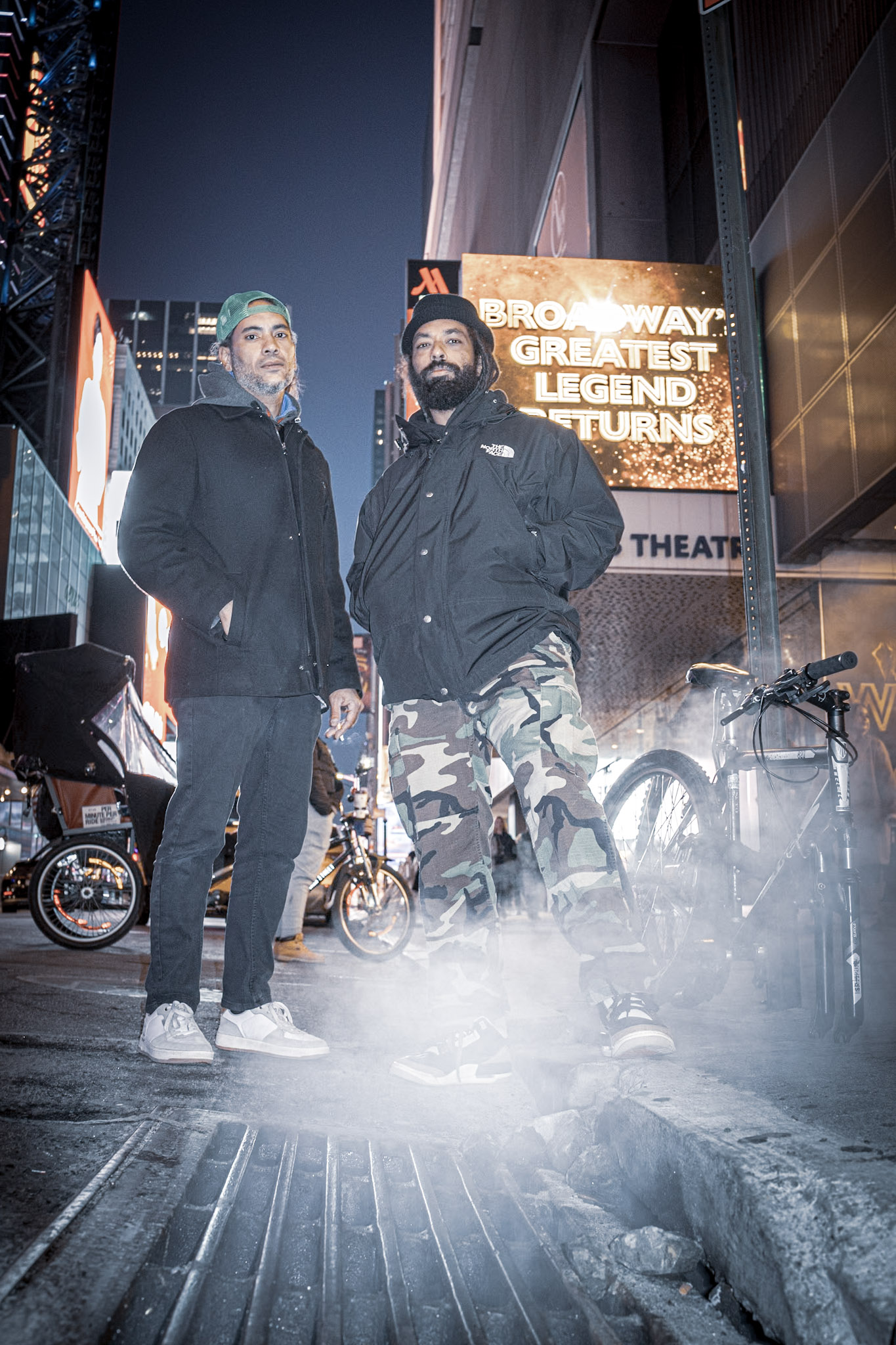 Yasser and EPHNIKO in Times Square at night.